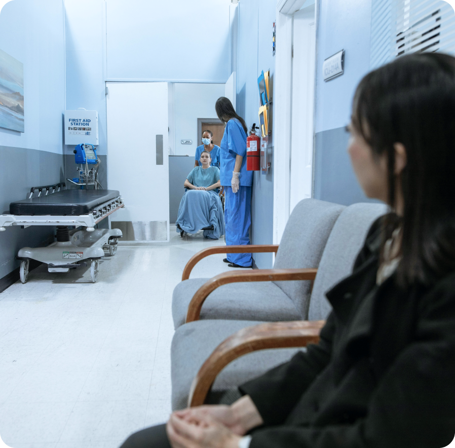 woman sitting in waiting area of hospital